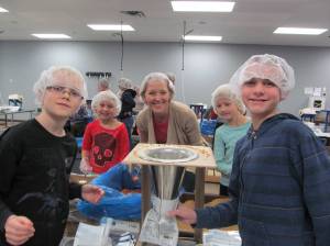 Feed My Starving Children has unique "helmets" for service