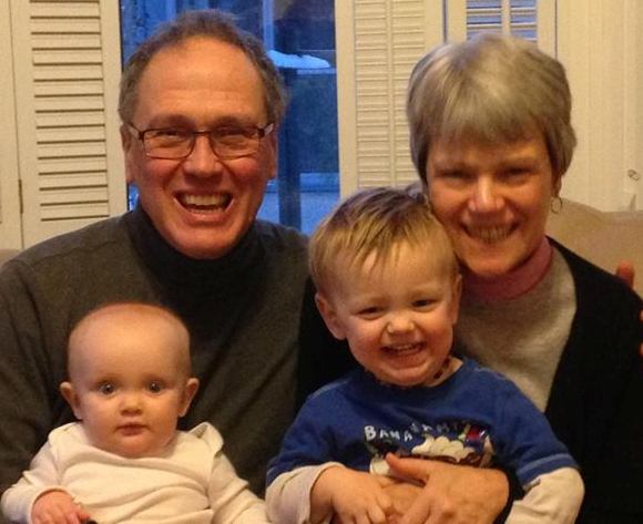 My wife Carolyn and I hold in our laps two children of God, Grace and Jack. 